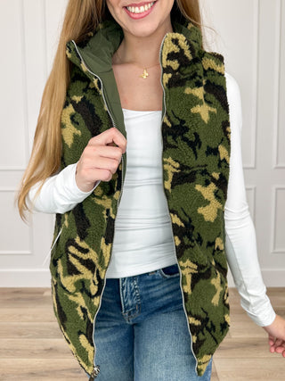 Reversible vest with camo sherpa front and zipper trim, green reverse side