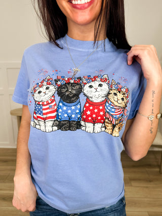 Blue short-sleeve graphic tee with patriotic cat lineup across chest