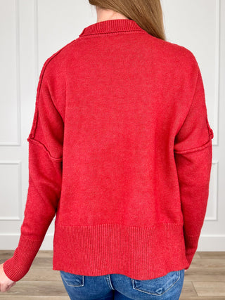 Red knit long-sleeve sweater back view with crew neck and ribbed hem