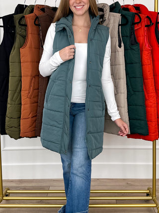 Teal green quilted puffer vest with hood, button front, side pockets