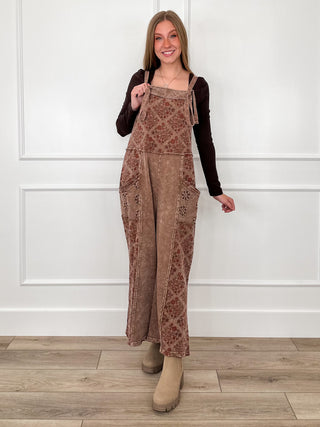 Brown cotton jumpsuit with square neck, patchwork panels, adjustable shoulder straps