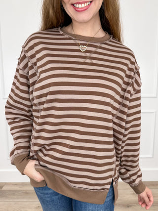 Brown striped knit long-sleeve top with rounded neckline and contrast hem/cuffs