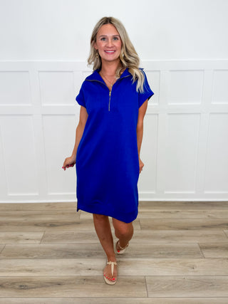 Blue knit shift dress with short sleeves and half-zip front