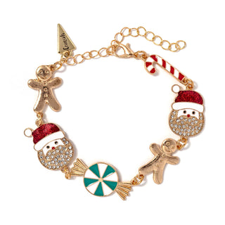 Gold-tone charm bracelet with gingerbread man, Santa face, candy cane, and peppermint circle