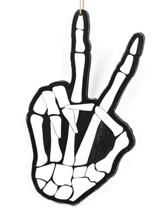 Black hand-shaped wood ornament with white skeletal pattern and hanging loop