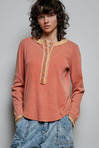 Coral pink knit henley top with button placket and long sleeves