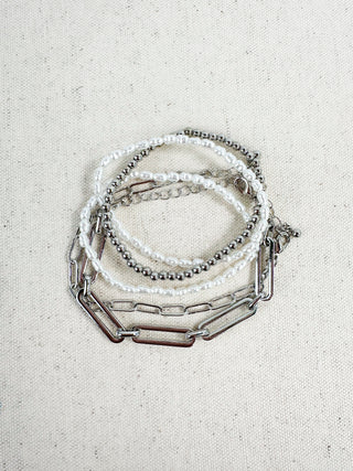 Silver-tone bracelet set with pearl beads, beaded strand, and link chains