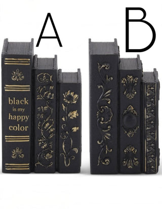 Two resin book decor stacks in dark with gold designs; one shows 'black is my happy color'