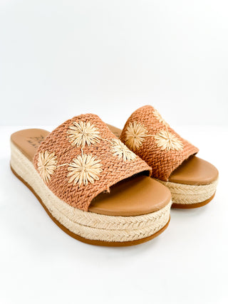 Tan woven platform slide sandals with daisy appliques and tan footbed