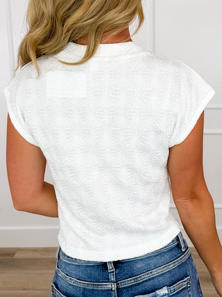 Lightweight white cropped top back view with short sleeves, textured fabric