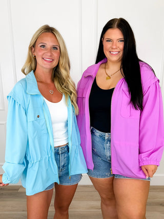 Lightweight hooded long-sleeve jackets in blue and purple, front zippers and pockets