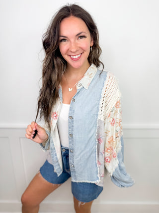 Blue long-sleeve button-up top with lace crochet trim and floral sleeve panels