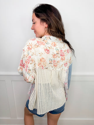 Floral long-sleeve button-up top with lace back yoke and blue hem