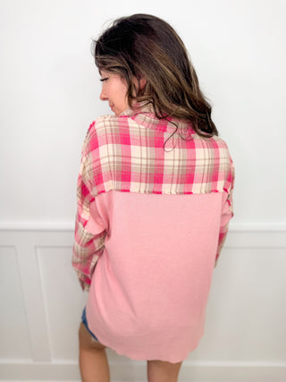 Pink plaid long-sleeve button-up top with open back and curved hem