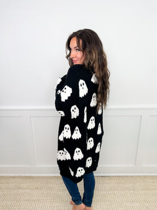 Reversible knit cardigan, black with white ghost pattern, open front (back)
