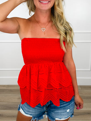 Red lightweight smocked tube top with eyelet peplum hem