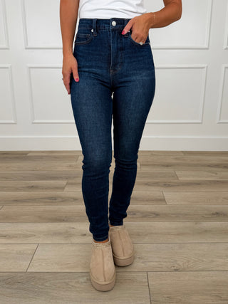 Dark wash skinny jeans, non-distressed, belt loops, button and zip fly