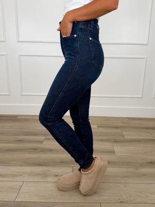 Dark wash skinny jeans with tummy control, non-distressed denim, five-pocket style