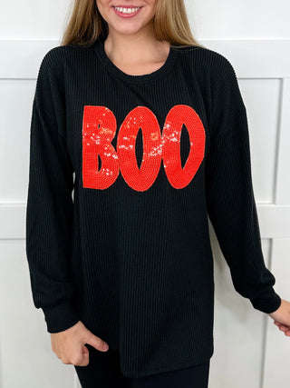 Black ribbed long-sleeve top with red 'BOO' graphic on chest, crew neck.