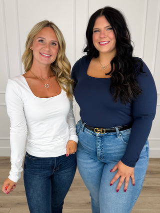Long-sleeve scoop-neck fitted top shown in light and dark colors