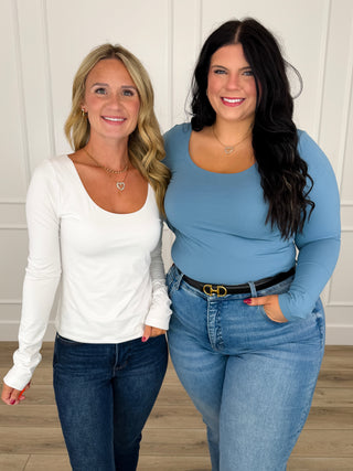 Long-sleeve scoop neck top in front view on two models