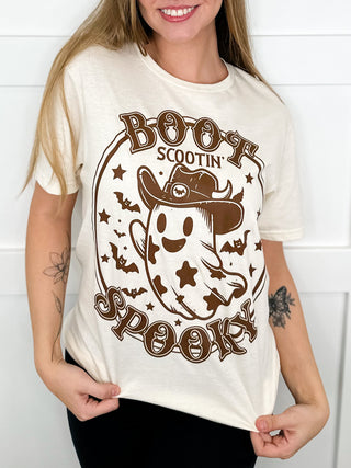 Cream short-sleeve cotton graphic tee with brown Halloween-style ghost face and text