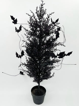 Black faux Halloween tree centerpiece with dangling bats and twigs