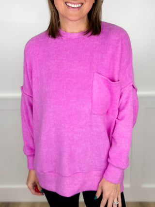 Orchid purple long-sleeve knit top with crew neck and chest pocket