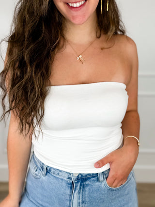 White rayon-blend tube top with ruched center and strapless straight neckline