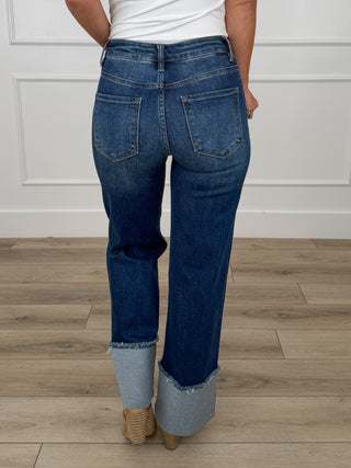 Mid-rise dark wash wide-leg jeans with back pockets and cuffed hems