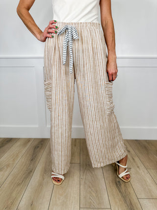 High-rise cargo wide-leg pants, tan vertical stripe, tie waist, cargo pockets, wide leg