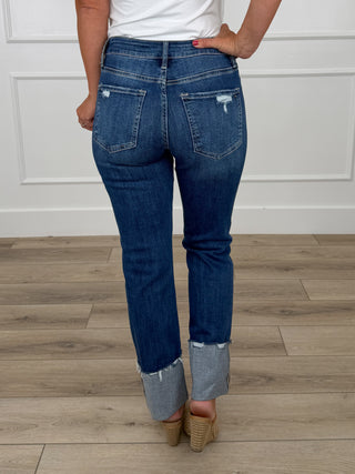 Mid-rise straight-leg dark blue jeans with back yoke and knee distress