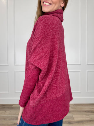 Wine red heather knit turtleneck top, side view with long dolman sleeves