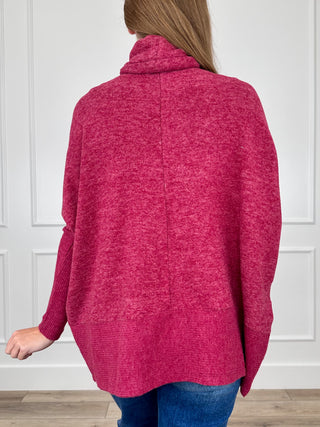 Wine red heather knit turtleneck top, back view with long dolman sleeves