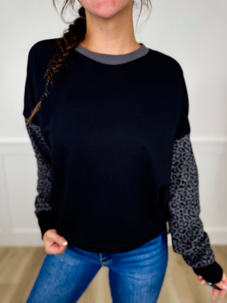 Black long sleeve top, gray crew neck, leopard-print sleeves