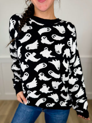Black knit long-sleeve sweater top with white cat pattern, crew neck