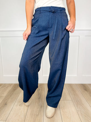 High-rise wide-leg dark wash denim jeans with elastic waist and front tie