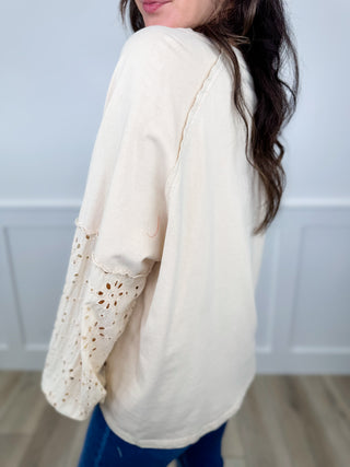 Oat cotton long sleeve top with lace cutout sleeve detail and relaxed fit