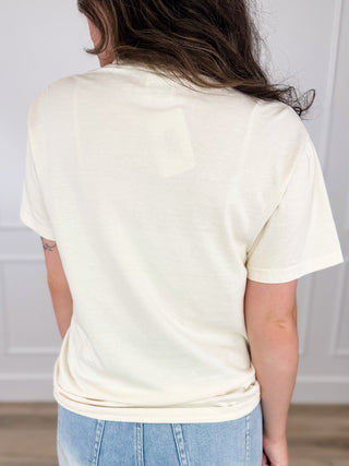 Cream cotton short-sleeve graphic tee shirt, back view, blank patch