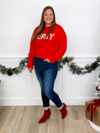 Long-sleeve knit sweater top, red with 'MERRY' knit graphic on front