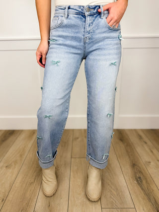 Risen Cassidy High Rise Barrel Leg Bow Detail Light Wash Cropped Blue Jeans