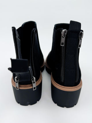 Black faux suede Chelsea booties, rear view with elastic gore and zip detail