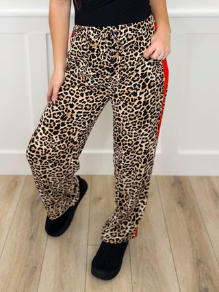 Tan and black leopard print high-rise pants with elastic waistband