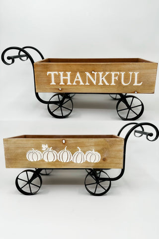 Wood wagon wall decor with black wheel frame, wooden sign reading THANKFUL