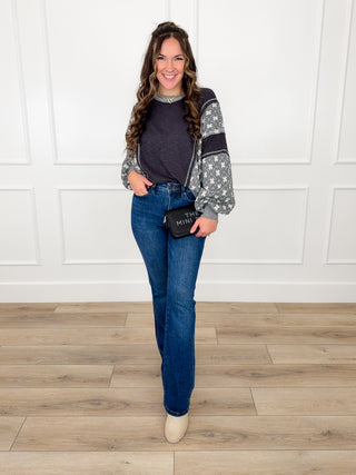 Dark blue bootcut jeans with waistband and belt loops, straight-to-flare silhouette
