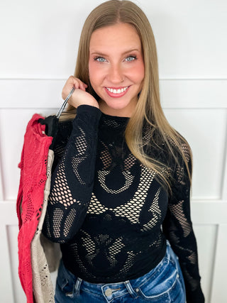 Black long-sleeve lace top with allover openwork pattern and crew neckline