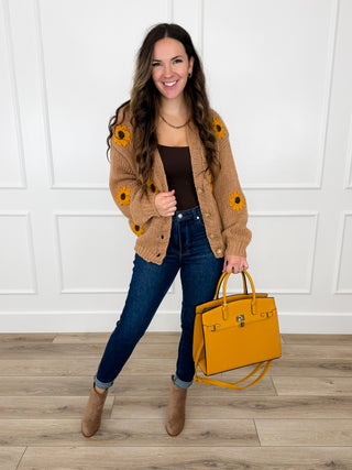 Tan knit button-up cardigan with sunflower patches