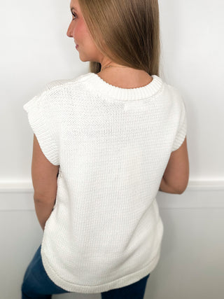 White short-sleeve knit sweater vest with ribbed crew neckline, back view