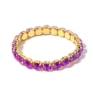 Gold-tone bracelet with oval purple faceted stones and gold disc links