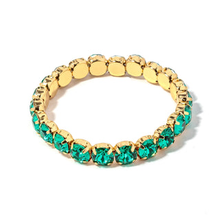 Gold-tone bracelet with oval teal-green faceted stones and gold disc links